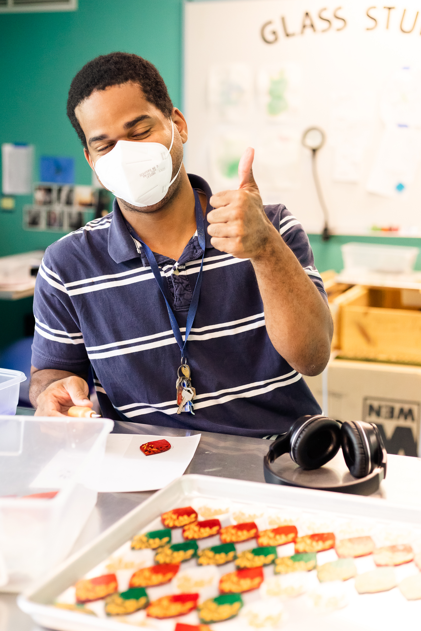 Program participant working on fused glass tableware